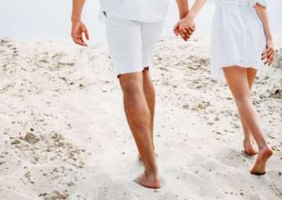 Macro image showcasing a network of spider veins, characterized by their thin, web-like appearance in red or blue, visible just beneath the surface of the skin.